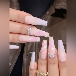 Pink long press on nails with butterflies and rhinestones for Valentine’s cute